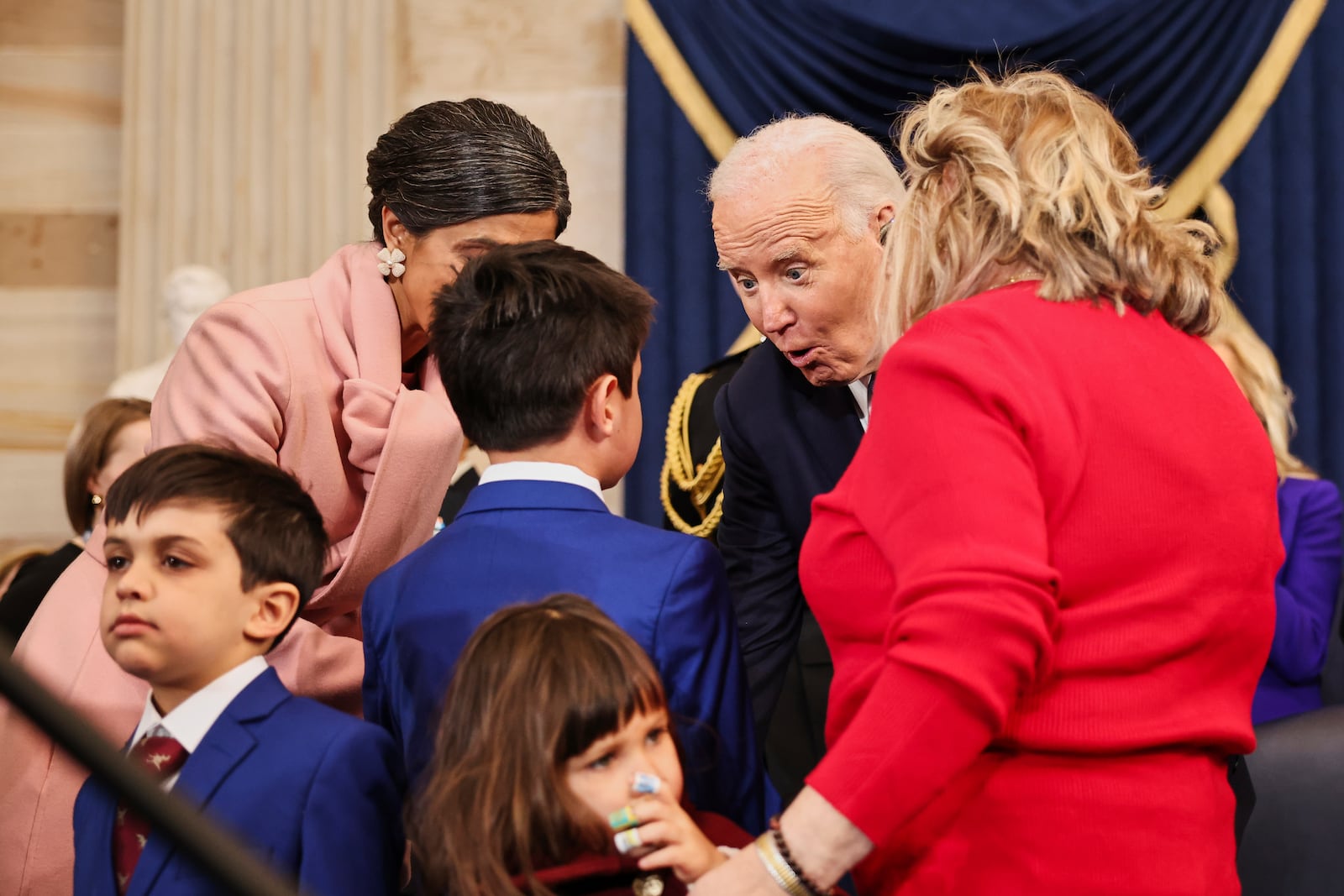 President Joe Biden reacts with the family of Vice President-elect JD Vance, R-Ohio, during the 60th Presidential Inauguration in the Rotunda of the U.S. Capitol in Washington, Monday, Jan. 20, 2025. (Chip Somodevilla/Pool Photo via AP)