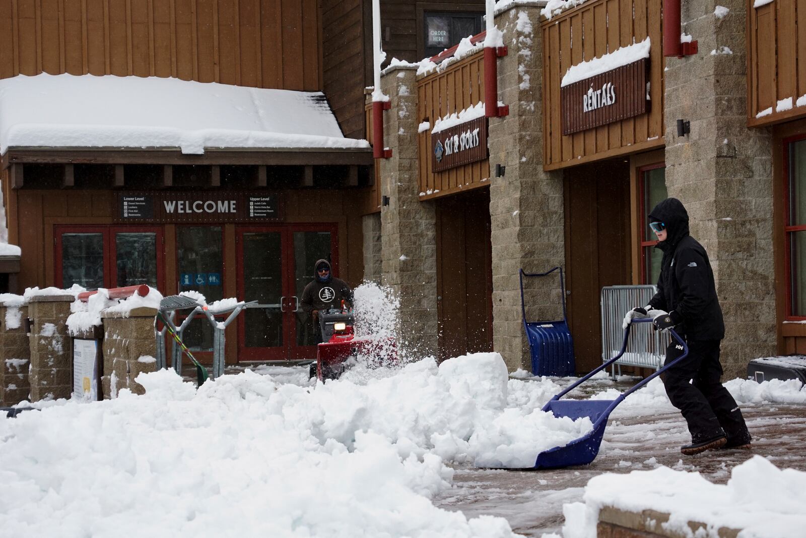 Workers clear walking paths with snow blowers during a storm Thursday, Nov. 21, 2024, at Sugar Bowl Ski Resort in Norden, Calif. (AP Photo/Brooke Hess-Homeier)