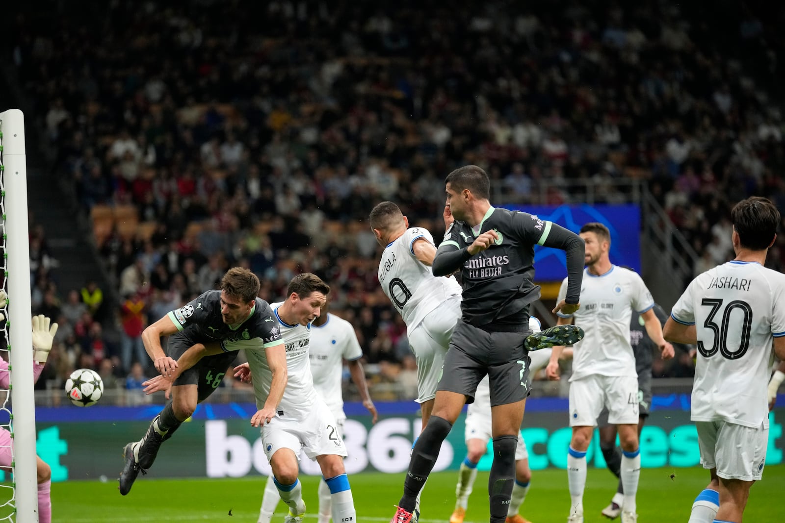 AC Milan's Christian Pulisic, not seen, scores direct from the corner his side's first goal during the Champions League opening phase soccer match between AC Milan and Club Brugge at the San Siro stadium in Milan, Italy, Tuesday, Oct. 22, 2024. (AP Photo/Antonio Calani)