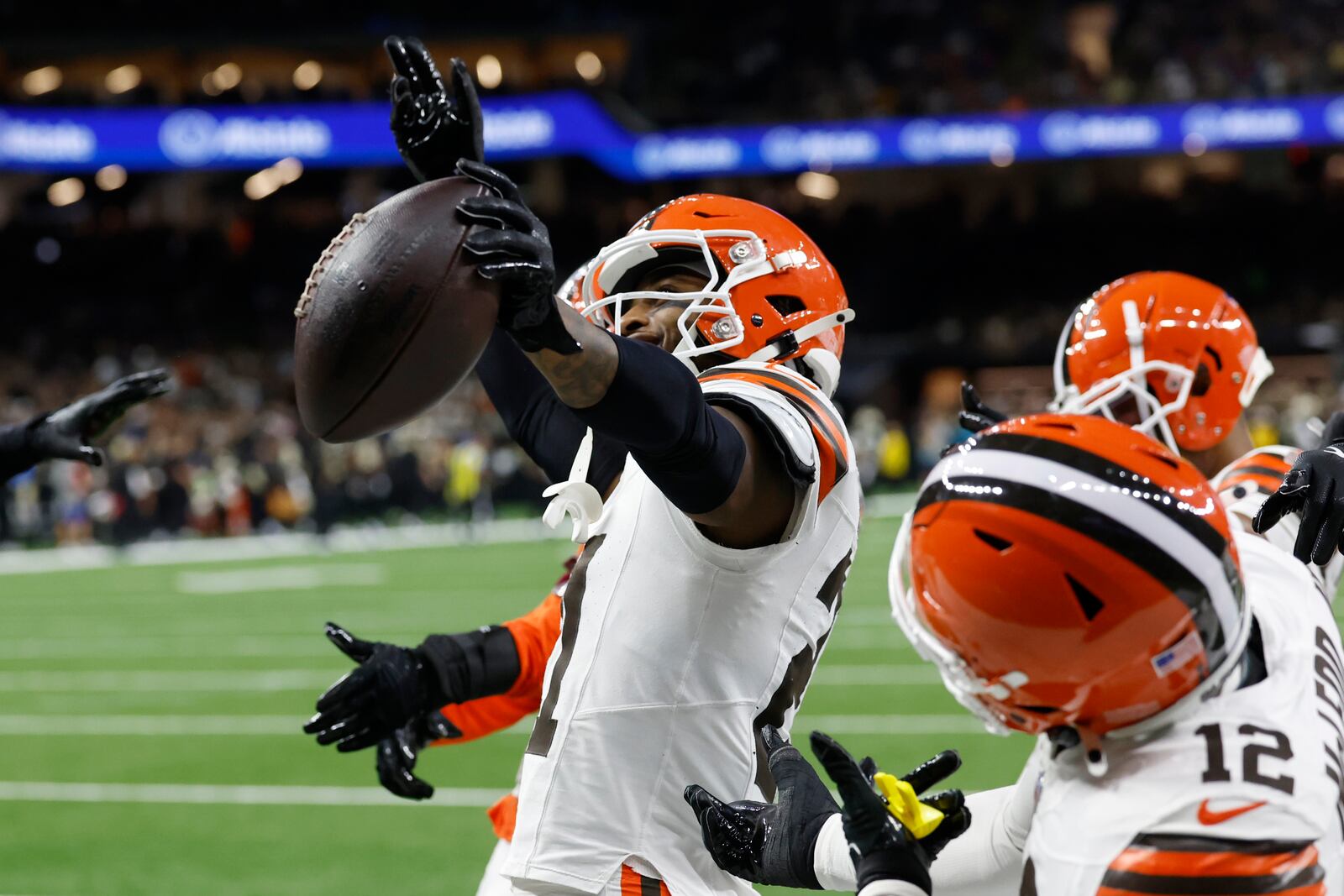 Cleveland Browns cornerback Denzel Ward, left, celebrates an interception in the first half of an NFL football game against the New Orleans Saints in New Orleans, Sunday, Nov. 17, 2024. (AP Photo/Butch Dill)