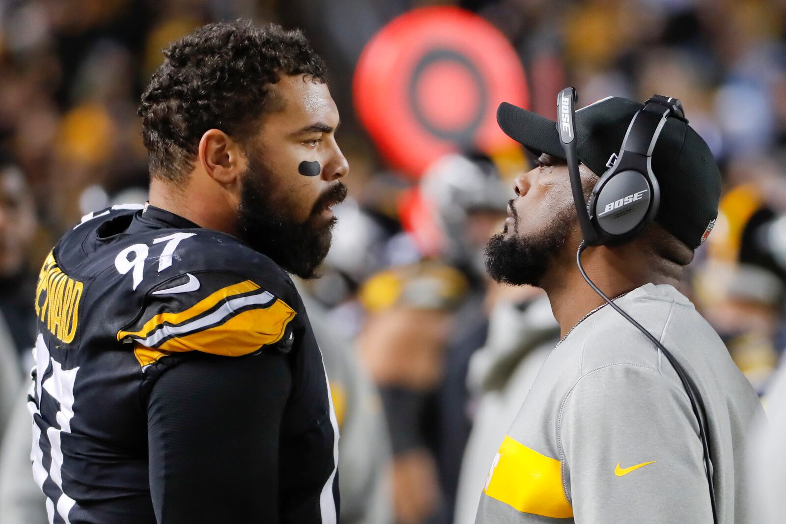 FILE - Pittsburgh Steelers head coach Mike Tomlin, right, talks with defensive end Cameron Heyward (97) in the second half of an NFL football game against the Los Angeles Chargers, Dec. 2, 2018, in Pittsburgh. (AP Photo/Gene J. Puskar, File)