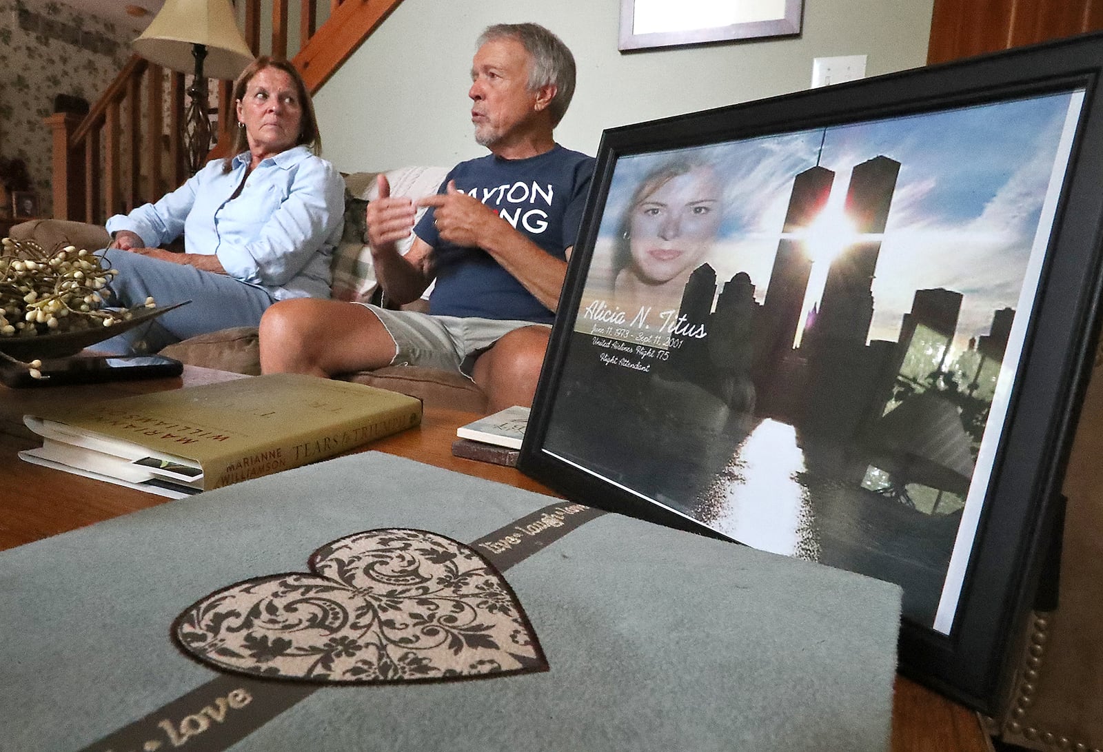 Bev and John Titus talk about their daughter, Alicia, who was a flight attendant on one of planes that struck the World Trade Center on 9/11. BILL LACKEY/STAFF