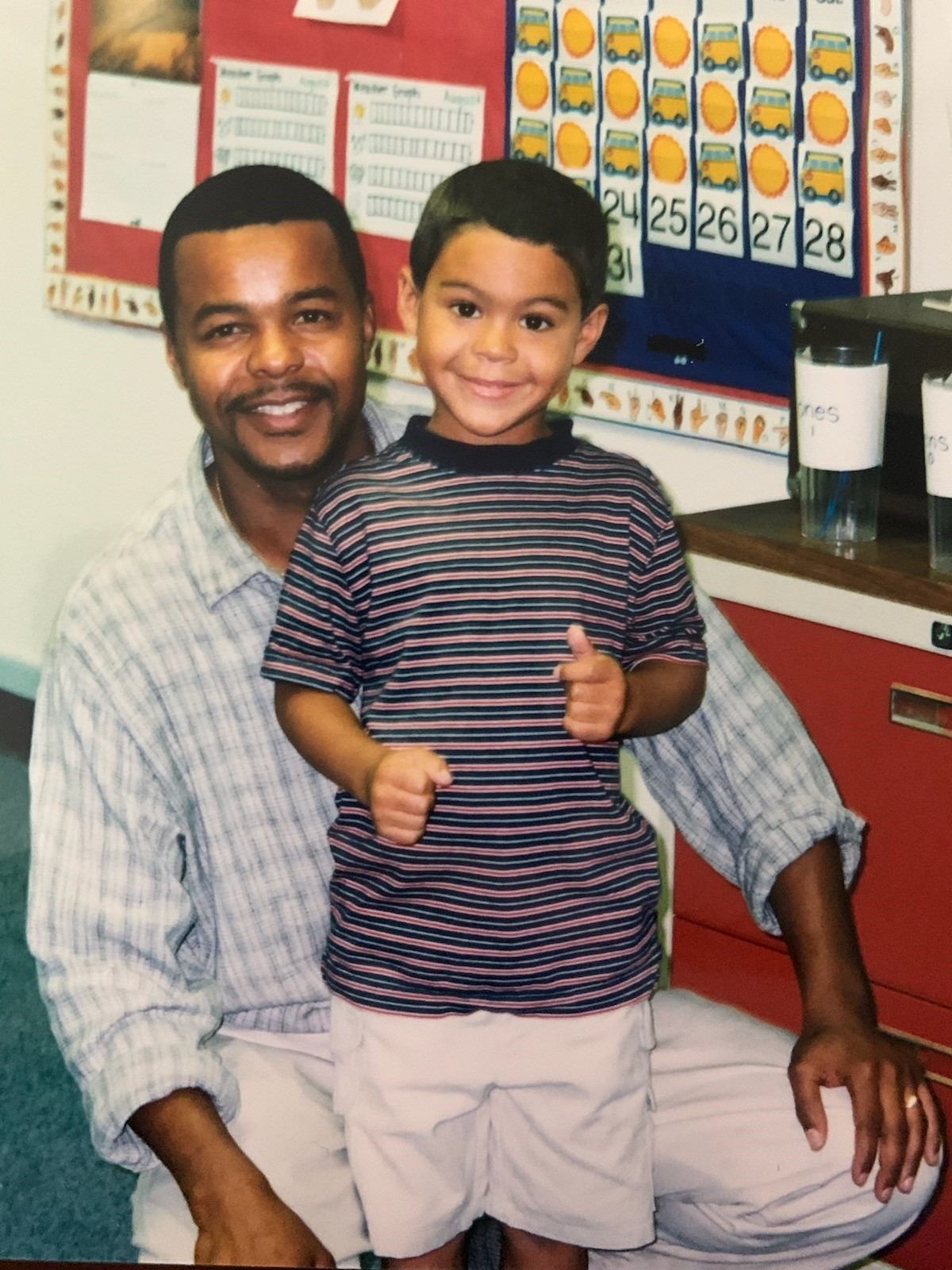 Darian Reynolds as a little boy with his dad, David. CONTRIBUTED