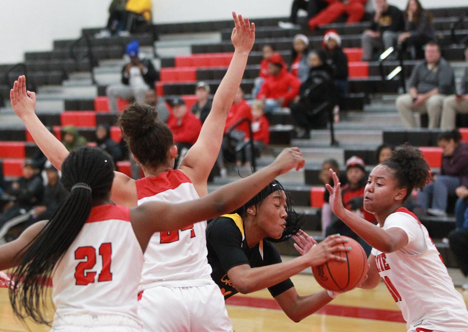 Cotie McMahon of Centerville (with ball) draws three Wayne defenders. Wayne defeated visiting Centerville 56-37 in a GWOC girls high school basketball game on Wednesday, Dec. 11, 2019. MARC PENDLETON / STAFF