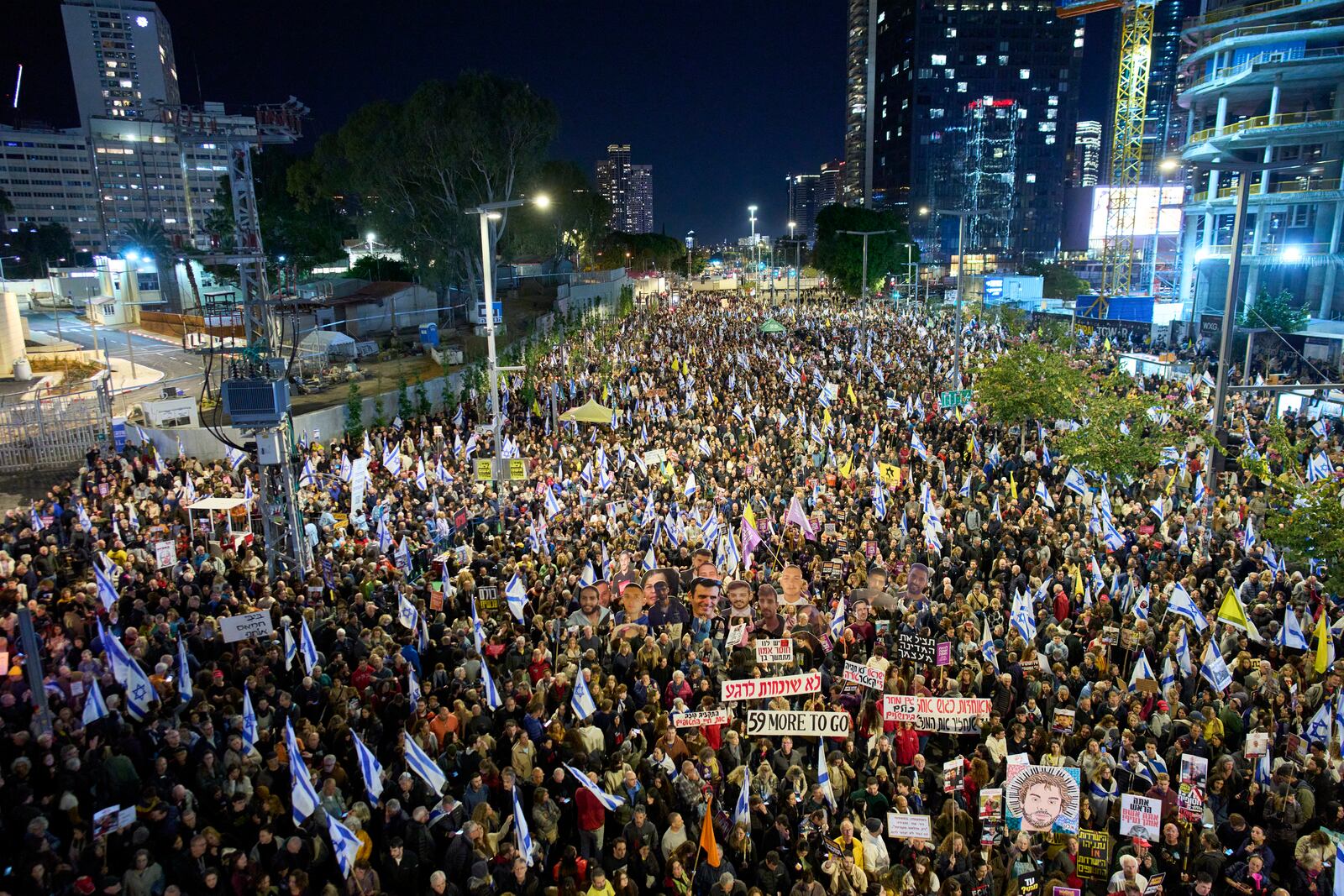 People take part in a protest demanding the immediate release of hostages held by Hamas in the Gaza Strip, in Tel Aviv, Israel, Saturday, March 22, 2025. (AP Photo/Ohad Zwigenberg)