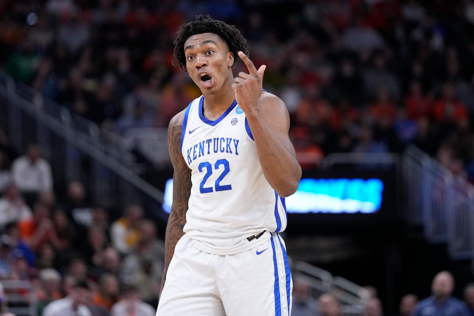 Kentucky center Amari Williams (22) reacts to over-throwing a pass to a teammate during the first half in the second round of the NCAA college basketball tournament against Illinois, Sunday, March 23, 2025, in Milwaukee. (AP Photo/Kayla Wolf)