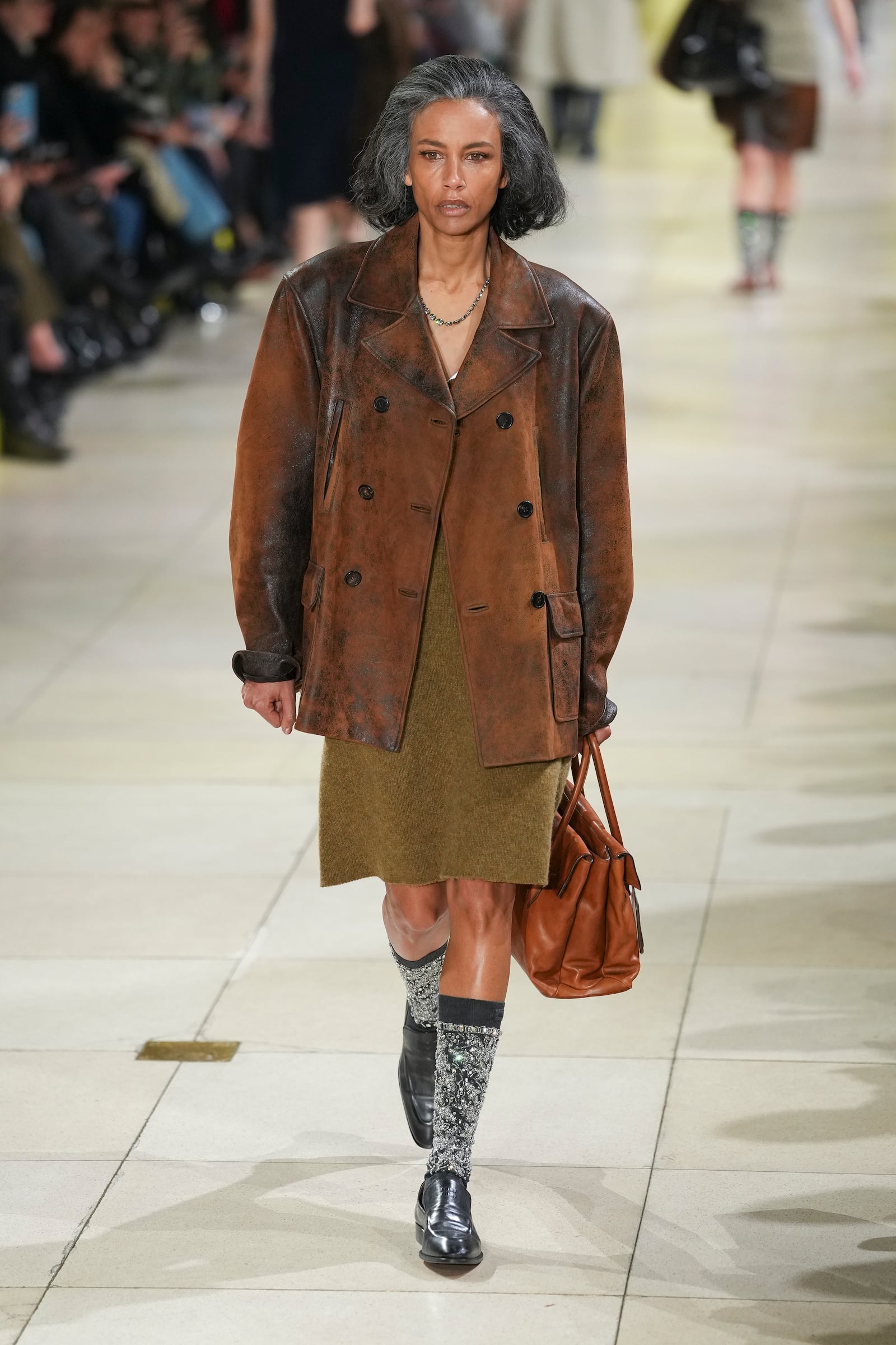 A model wears a creation as part of the Miu Miu Fall/Winter 2025-2026 Womenswear collection presented Tuesday, March 11, 2025. in Paris. (Photo by Scott A Garfitt/Invision/AP)