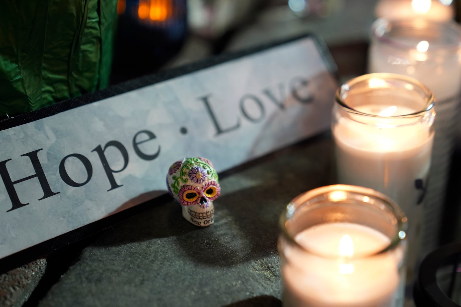 A memorial sits outside a restaurant along Bourbon Street in the French Quarter, Thursday, Jan. 2, 2025 in New Orleans. (AP Photo/George Walker IV)