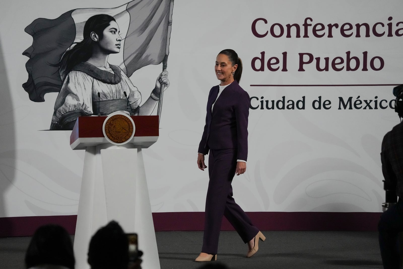 Mexican President Claudia Sheinbaum arrives for her morning press conference at the National Palace in Mexico City, Tuesday, March 4, 2025. (AP Photo/Marco Ugarte)