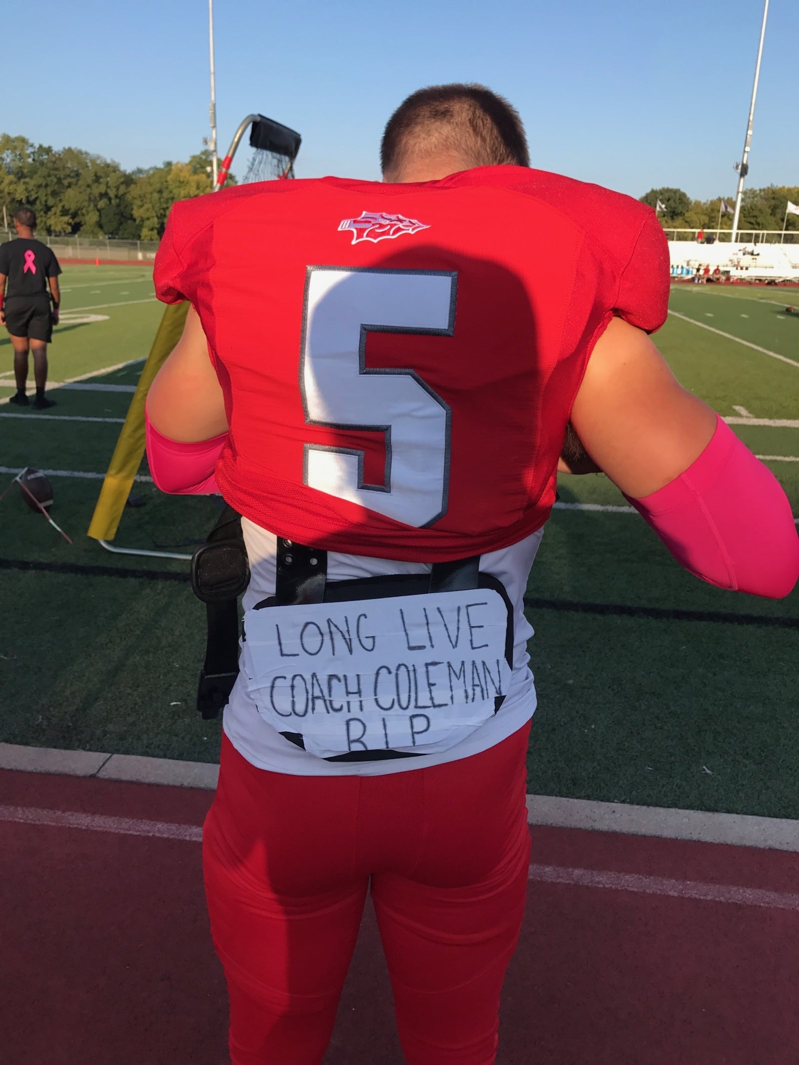 Stebbins high defensive back and running back Cadan Keller penned a tribute – “Long Live Coach Coleman, RIP” – on his back plate before Friday night’s game. Several of the players wore pink accessories to remember Coleman’s long bout with cancer. Coaches and fans wore pink T-shirts. There was a moment of silence before the game for Coleman, who died Thursday.  Tributes to him flashed on the video board at Edmundson Stadium and a sign hung on the front railing of the student section said “Fight Like Coleman." Tom Archdeacon/CONTRIBUTED