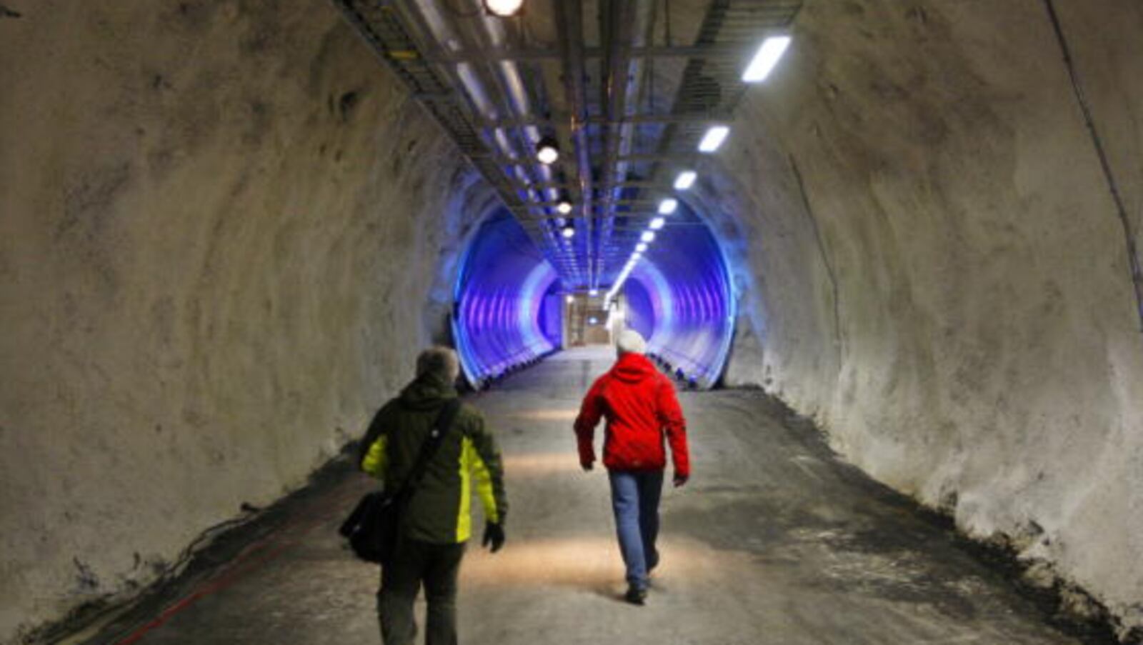 People walk into a seed vault on February 24, 2008 near Longyabyen.  Aimed at providing mankind with a Noah's Ark of food in the event of a global catastrophe, an Arctic "doomsday vault" filled with samples of the world's most important seeds will be inaugurated here on Fenbruary 26. European Commission President Jose Manuel Barroso and Nobel Peace Prize winning environmentalist Wangari Matai will be among the personalities present at the inauguration of the vault, which has been carved into the permafrost of a remote Arctic mountain, just some 1,000 kilometres (620 miles) from the North Pole. AFP PHOTO/ Hakon Mosvold Larsen / Scanpix - NORWAY OUT (Photo credit should read Hakon Mosvold Larsen/AFP/Getty Images)