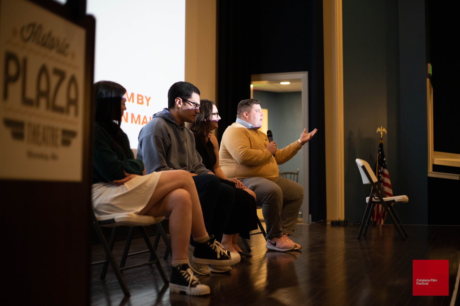 Writer and director Evan Maines (with microphone) and crew for his short film "Trash Wife" at the 2023 Catalano Film Festival. "Trash Wife" received wins for Best Director, Best Actor and Best Original Screenplay.