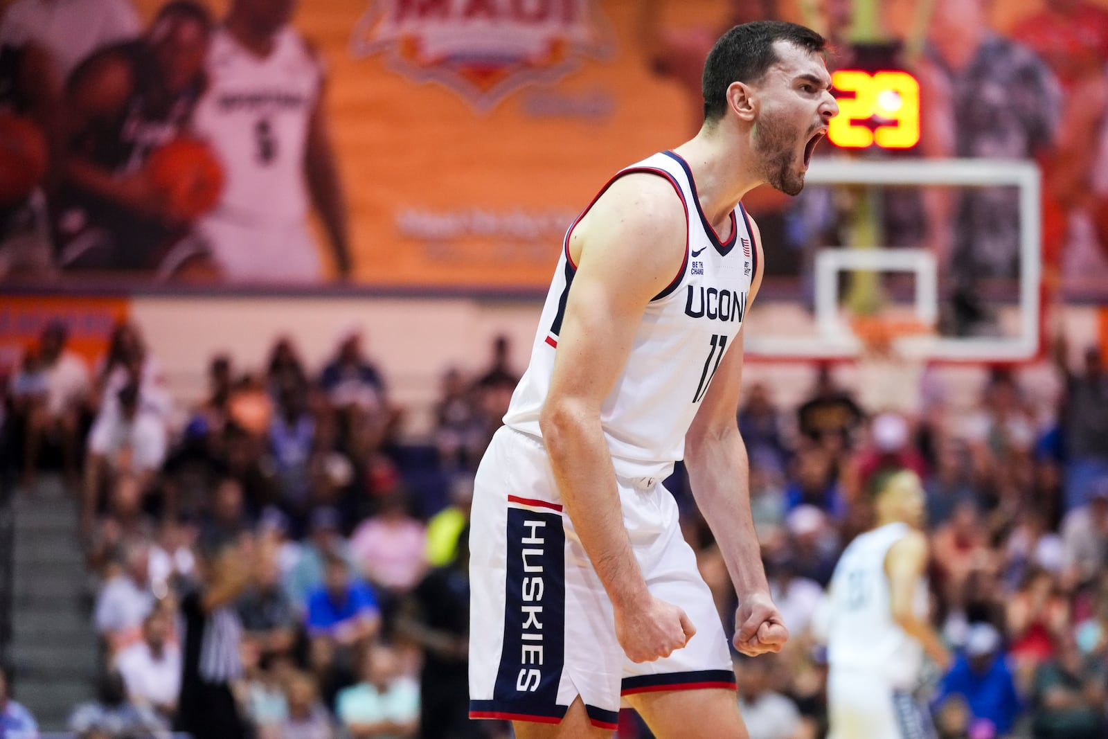 UConn forward Alex Karaban (11) reacts during the first half of an NCAA college basketball game against Memphis at the Maui Invitational Monday, Nov. 25, 2024, in Lahaina, Hawaii. (AP Photo/Lindsey Wasson)