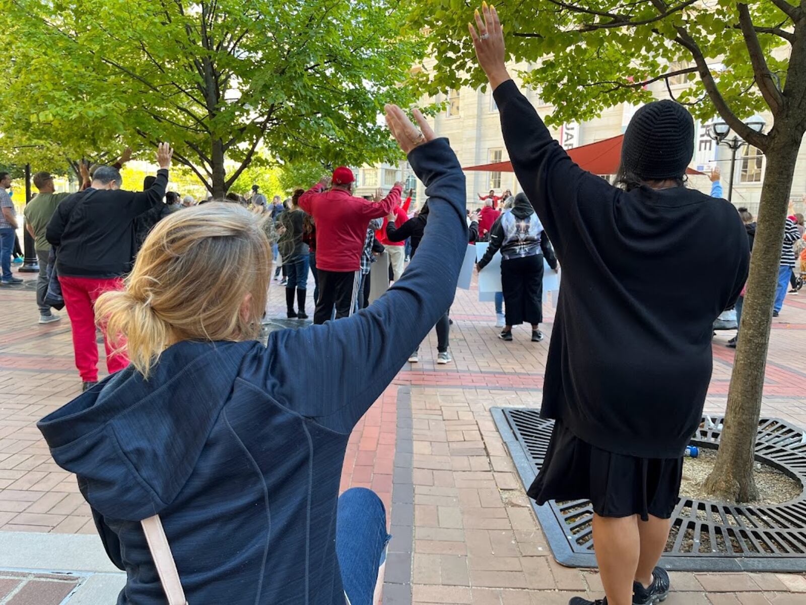 Participants paused to pray on Courthouse Square Sunday as the Declare Dayton group of churches gathered to march and worship. THOMAS GNAU/STAFF