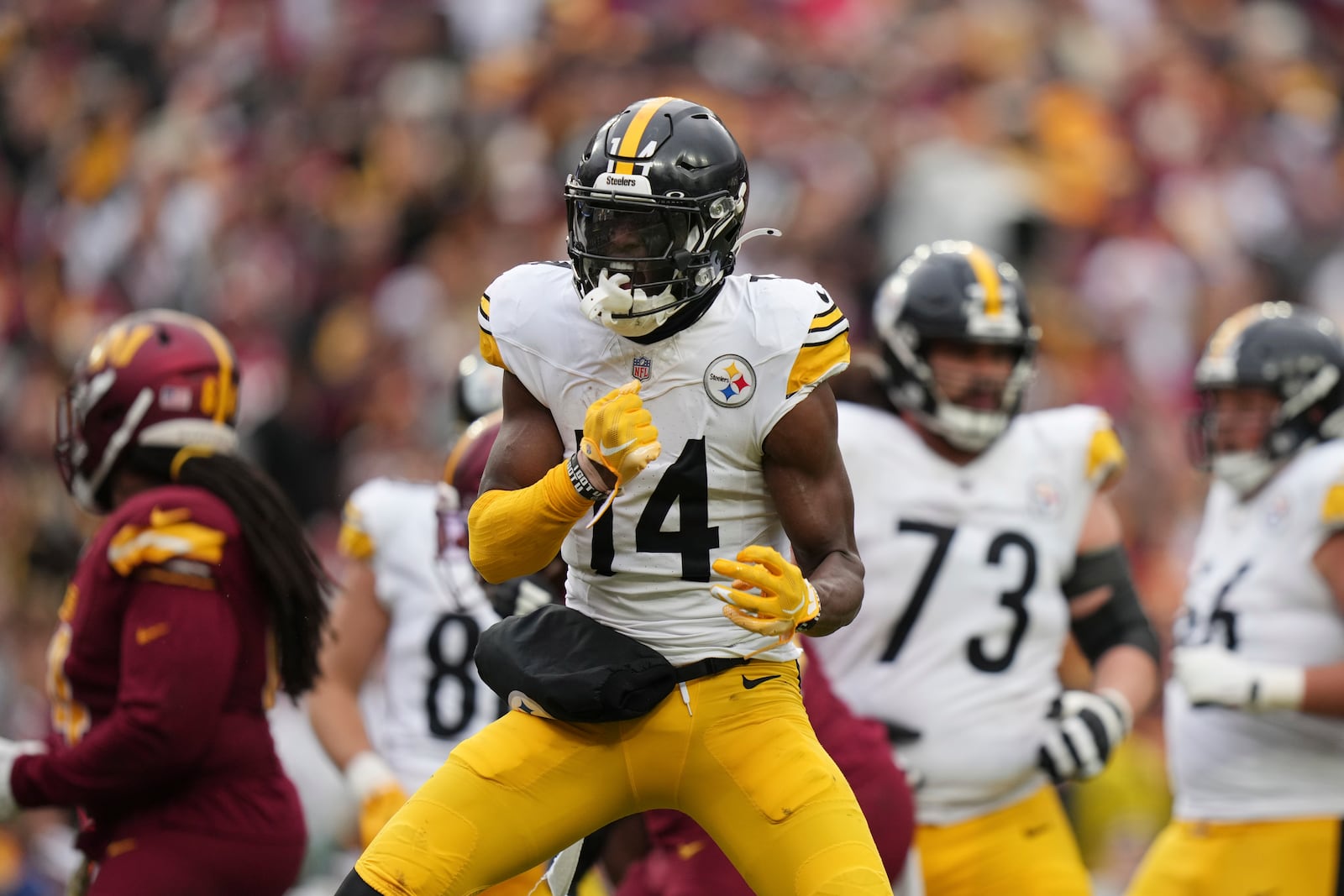 Pittsburgh Steelers wide receiver George Pickens (14) reacts after a first down during the second half of an NFL football game against the Washington Commanders, Sunday, Nov. 10, 2024, in Landover, Md. (AP Photo/Stephanie Scarbrough)