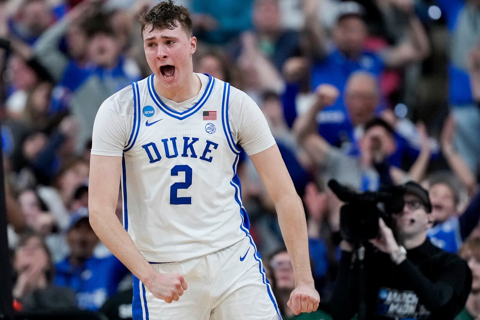 Duke forward Cooper Flagg (2) reacts after dunking during the first half in the second round of the NCAA college basketball tournament against Baylor, Sunday, March 23, 2025, in Raleigh, N.C. (AP Photo/Stephanie Scarbrough)