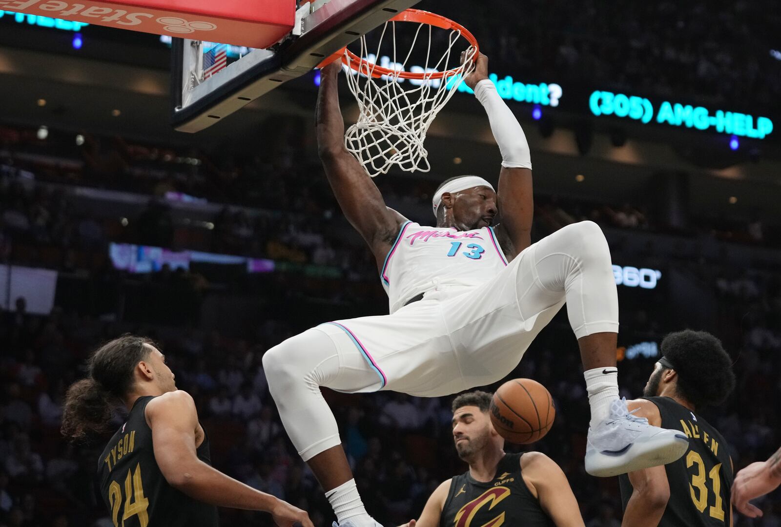 Miami Heat center Bam Adebayo (13) dunks during the first half of an NBA basketball game against the Cleveland Cavaliers, Wednesday, Jan. 29, 2025, in Miami. (AP Photo/Lynne Sladky)