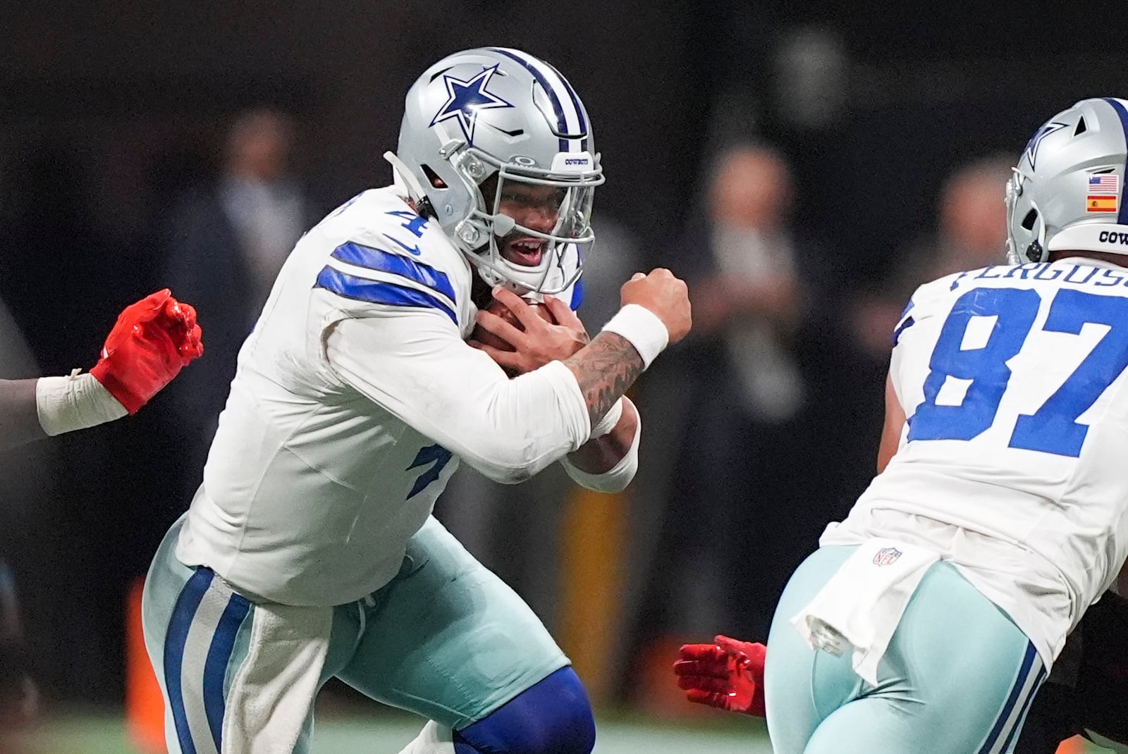 Dallas Cowboys quarterback Dak Prescott (4) carries during the second half of an NFL football game against the Atlanta Falcons, Sunday, Nov. 3, 2024, in Atlanta. (AP Photo/ Brynn Anderson)