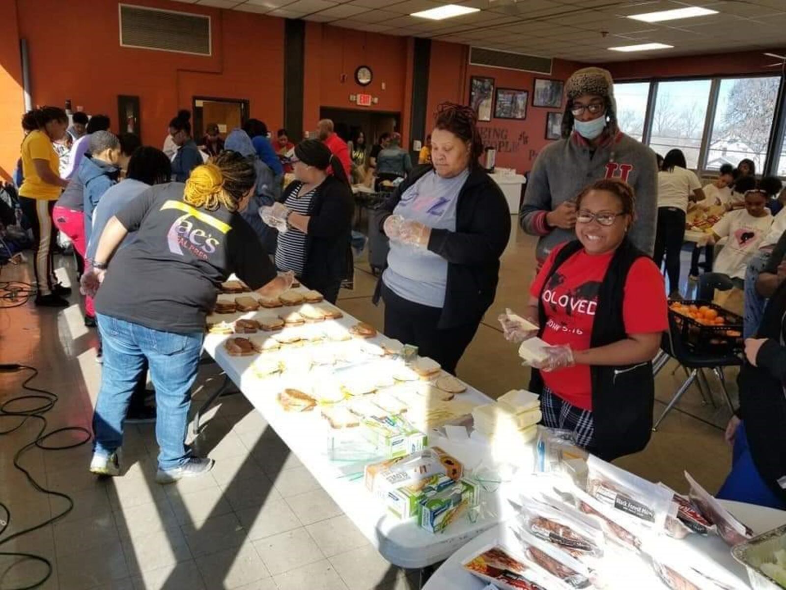 Ashley Browning is the founder of SoLoved, a community organization. She is picturedat Hashtag Lunchbag Dayton Chapter with Jordan Hockett. Brown bag  lunches were provided to community members.