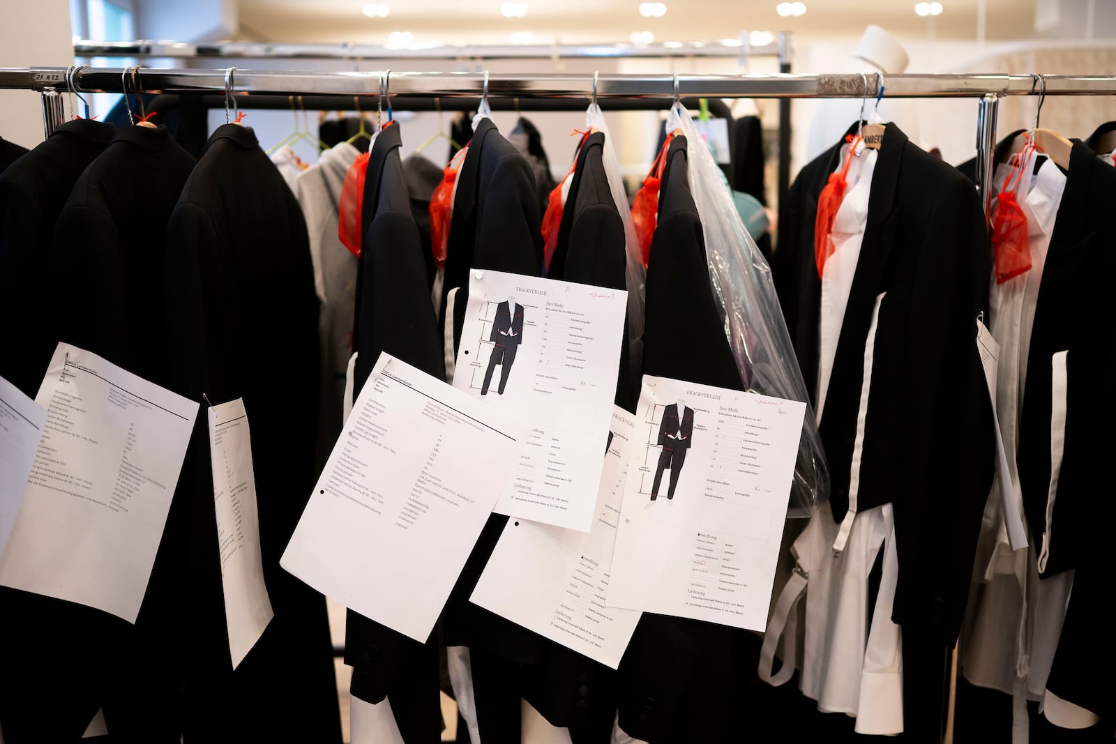 Prepared tailcoats and tuxedos wait to be rented in Lambert Hofer, a renowned costume workshop in Vienna, Austria, Wednesday, Febr 26, 2025. (AP Photo/Denes Erdos)