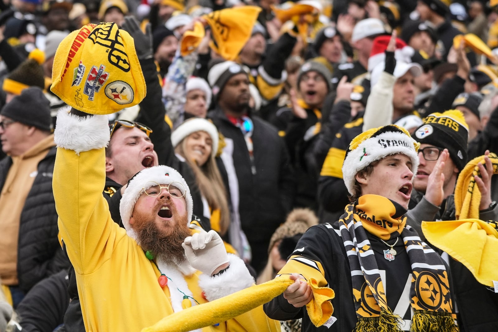 Pittsburgh Steelers fans cheer during the first half of an NFL football game between the Pittsburgh Steelers and the Kansas City Chiefs, Wednesday, Dec. 25, 2024, in Pittsburgh. (AP Photo/Gene J. Puskar)