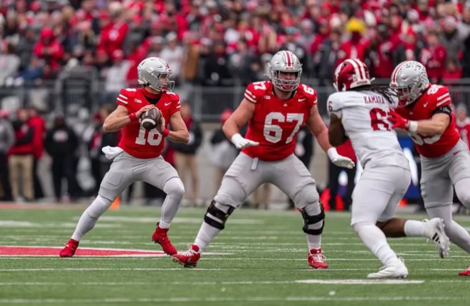 Ohio State's Austin Siereveld (67) protects quarterback Will Howard during a game this season vs. Indiana. Siereveld is a 2023 Lakota East graduate who has started seven games this season at right guard. Ohio State Athletics photo