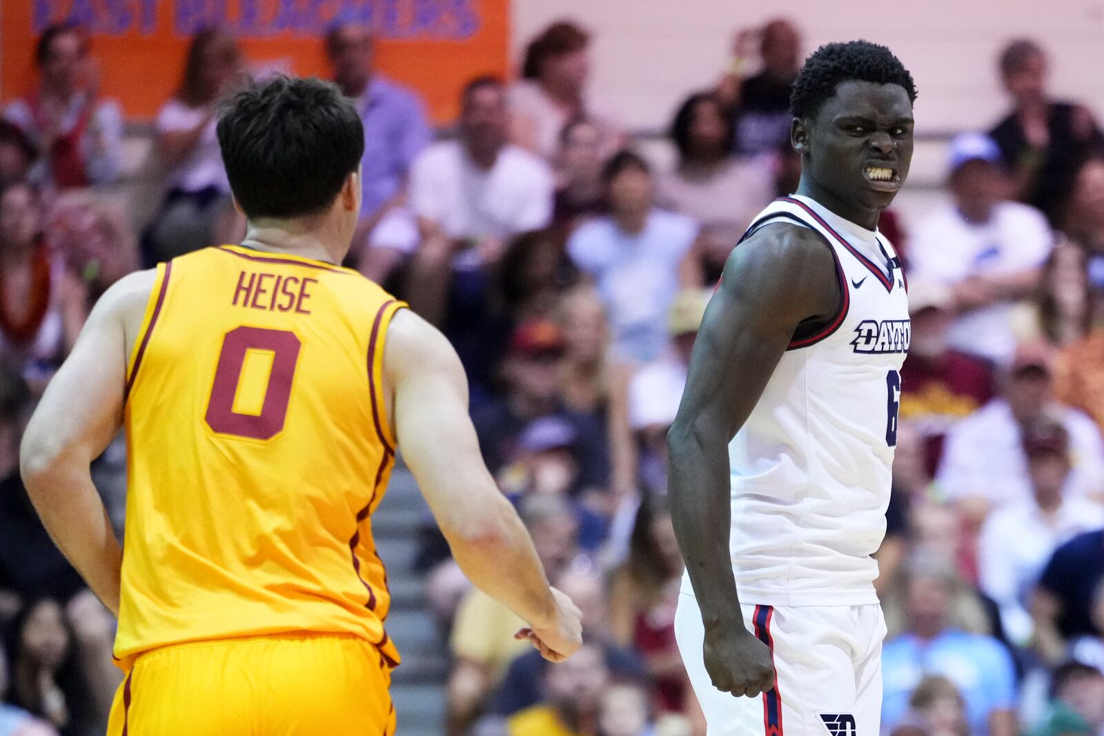 Dayton guard Enoch Cheeks, right, reacts after scoring as Iowa State guard Nate Heise (0) looks on during the second half of an NCAA college basketball game at the Maui Invitational Tuesday, Nov. 26, 2024, in Lahaina, Hawaii. Iowa State won 89-84. (AP Photo/Lindsey Wasson)