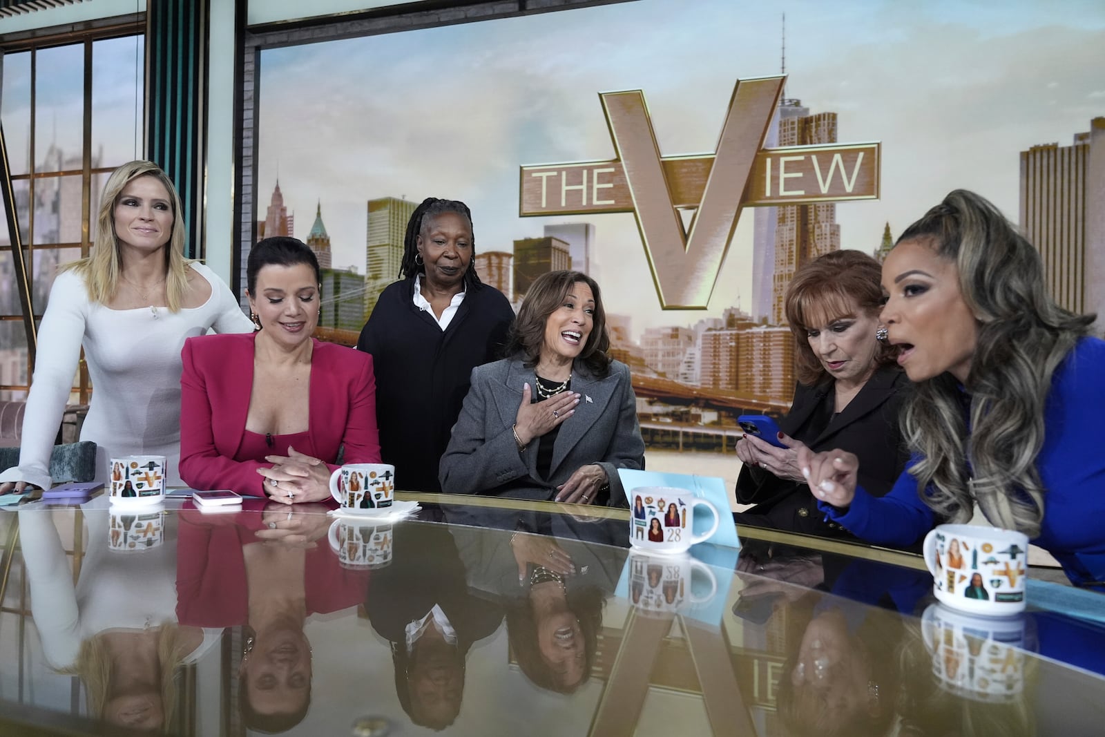 Democratic presidential nominee Vice President Kamala Harris chats with the hosts during a commercial break at The View, Tuesday, Oct. 8, 2024, in New York. (AP Photo/Jacquelyn Martin)