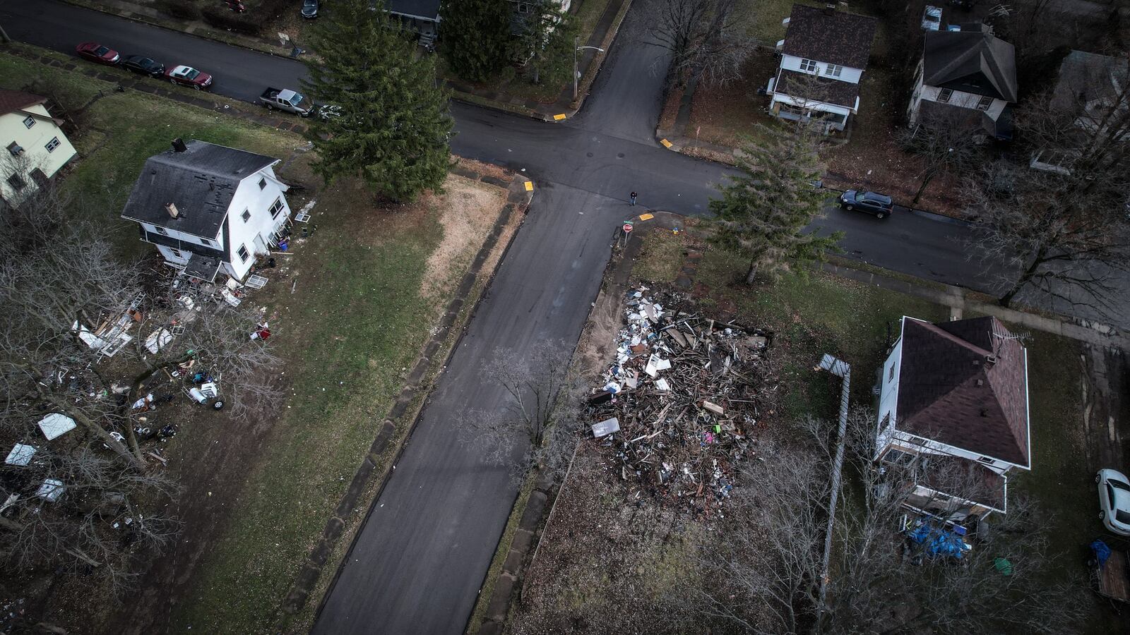 This home on Lorenz Ave. in Dayton burned down last year. The house was demolished but the debris was not removed, which has attracted illegal dumping. JIM NOELKER/STAFF