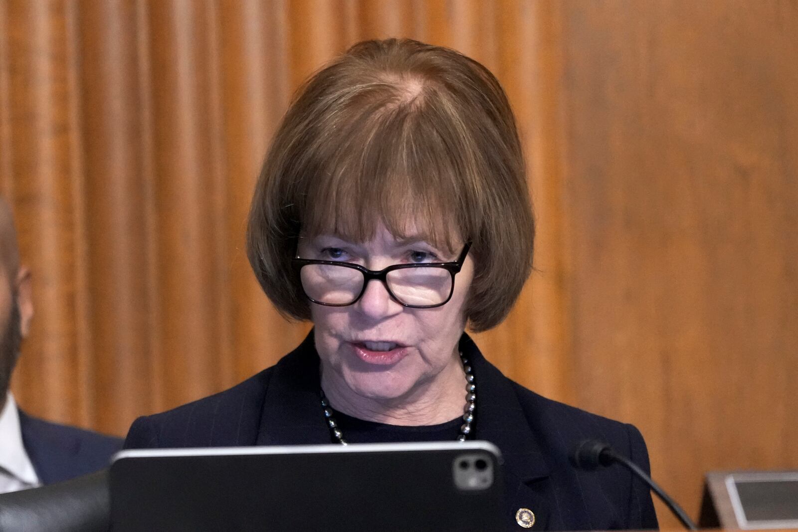 Sen. Tina Smith, D-Minn., speaks at the Senate Finance Committee confirmation hearing for Scott Bessent, President-elect Donald Trump's choice to be Secretary of the Treasury, at the Capitol in Washington, Thursday, Jan. 16, 2025. (AP Photo/Ben Curtis)