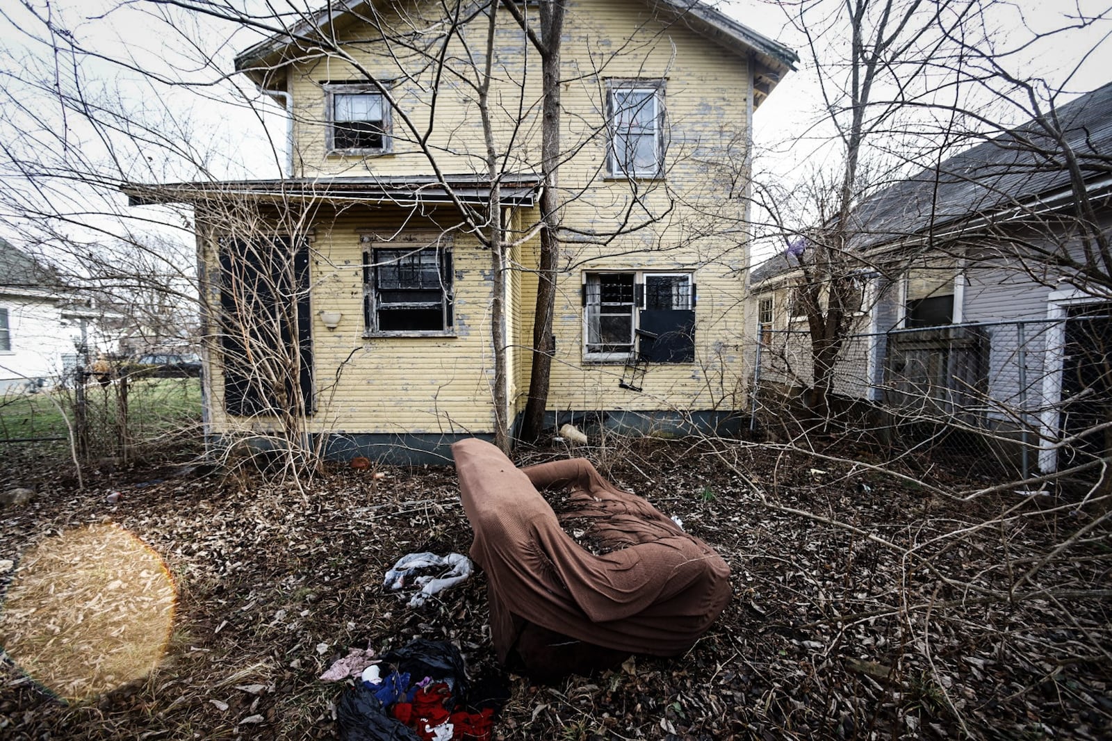 The city of Dayton plans to spend $22 million to remove more than 1,000 nuisance properties in the next several years. This vacant is on Huron Ave. in Dayton. JIM NOELKER/STAFF