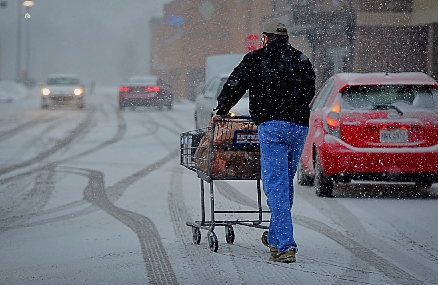 PHOTOS: Snow returns; brutally cold temperature ahead