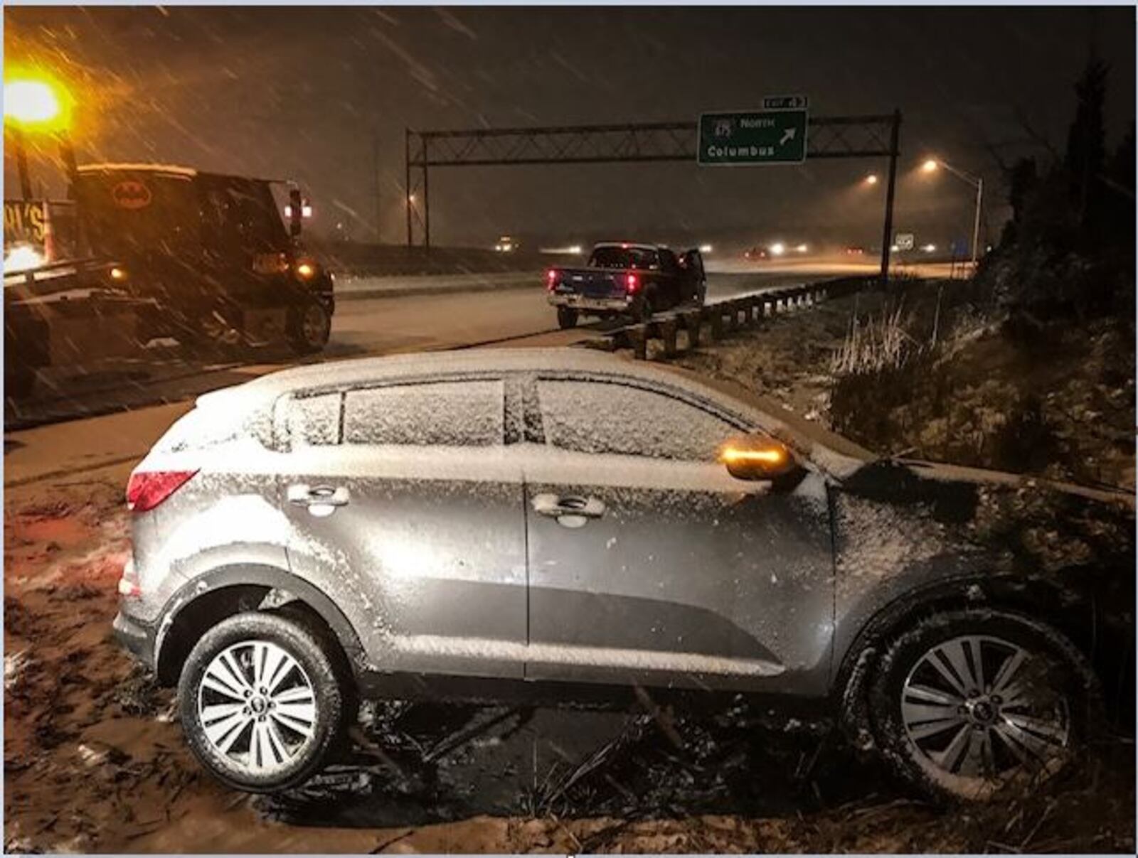 This vehicle hit the guardrail on I-75 South, near I-675, in Miami Twp. on Thursday night. (Jim Noelker/Staff)