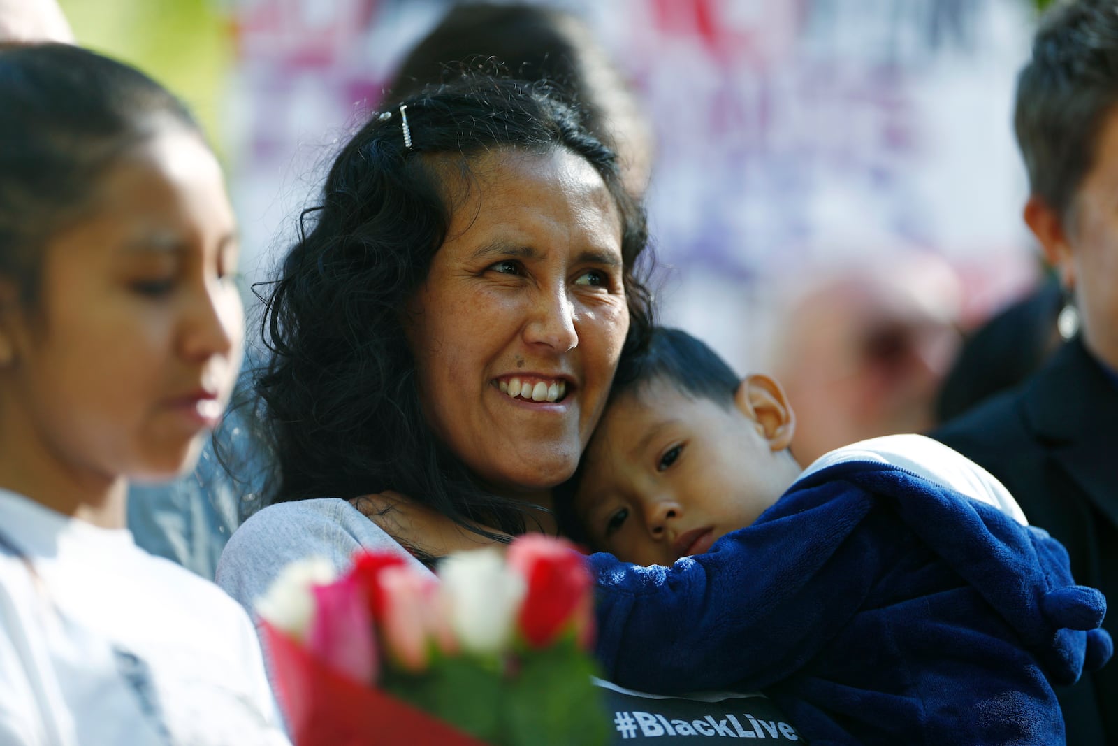 File - Jeanette Vizguerra, a Mexican immigrant who has lived in a church to avoid immigration authorities for the past three months, smiles after leaving the church early Friday, May 12, 2017, in downtown Denver. (AP Photo/David Zalubowski, File)