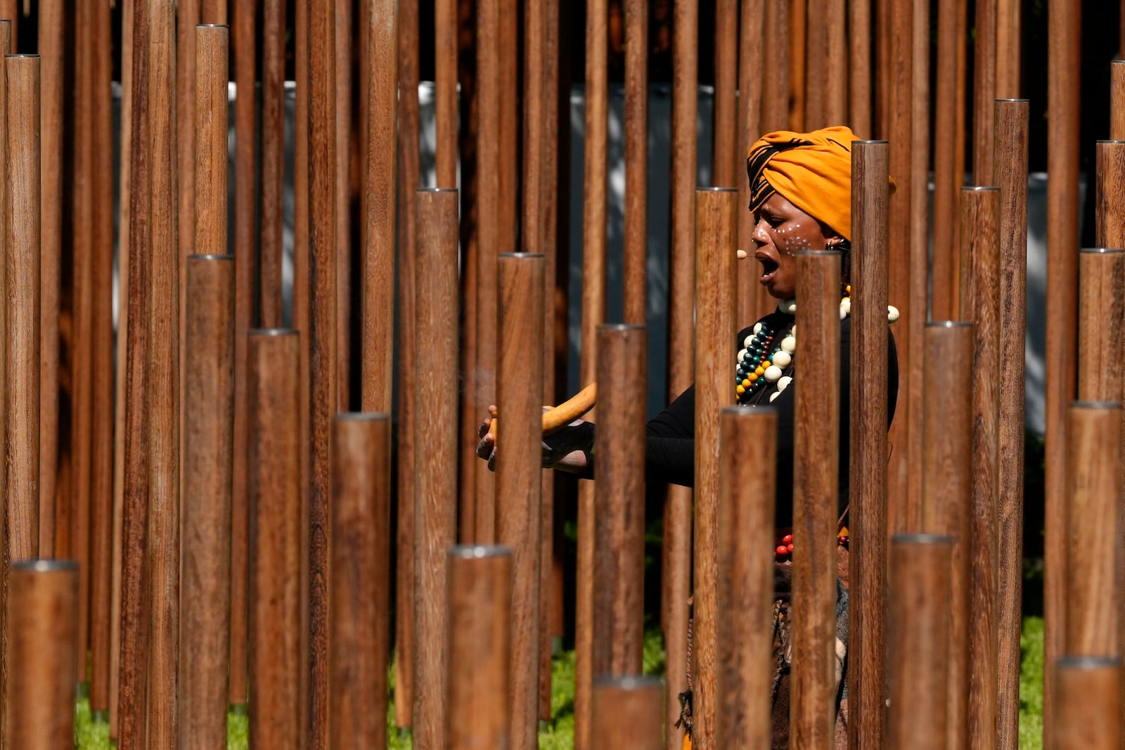 Lwanda Sindaphi, a praise poet performs a cultural tribute at the opening of a memorial dedicated to more than 1,700 Black South African servicemen who died in non-combatant roles in World War I and have no known grave, in Cape Town, South Africa, Wednesday, Jan. 22, 2025. (AP Photo/Nardus Engelbrecht)