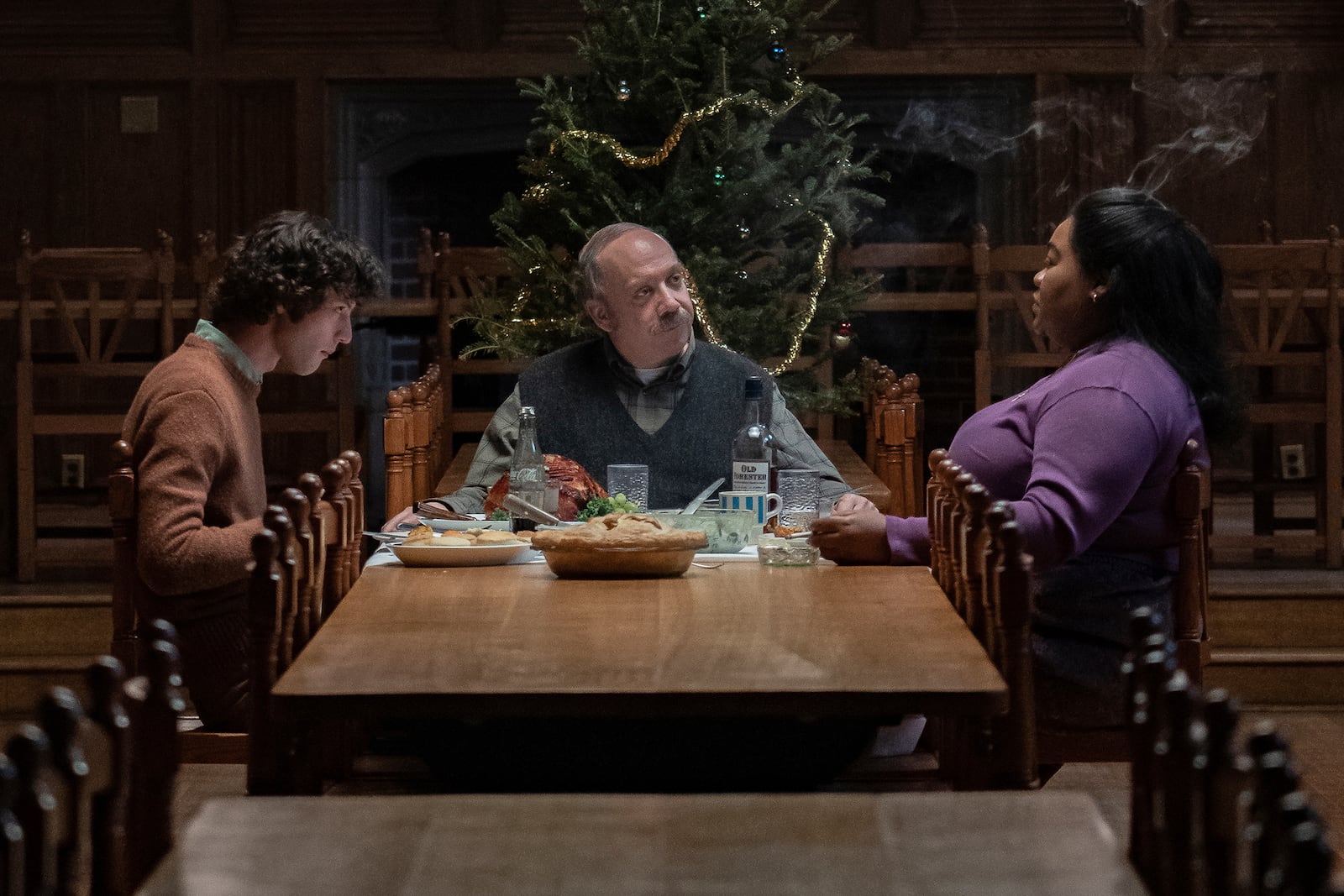 This image released by Focus Features Dominic Sessa stars as Angus Tully, Paul Giamatti as Paul Hunham and Da'Vine Joy Randolph as Mary Lamb in a scene from "The Holdovers." (Seacia Pavao/Focus Features via AP)