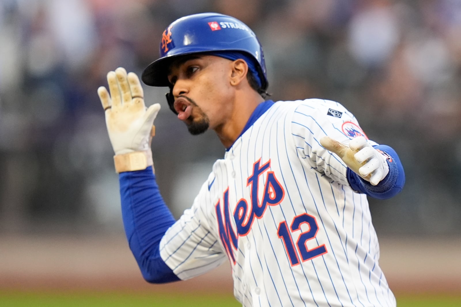 New York Mets' Francisco Lindor celebrates a single against the Los Angeles Dodgers during the first inning in Game 5 of a baseball NL Championship Series, Friday, Oct. 18, 2024, in New York. (AP Photo/Frank Franklin II)