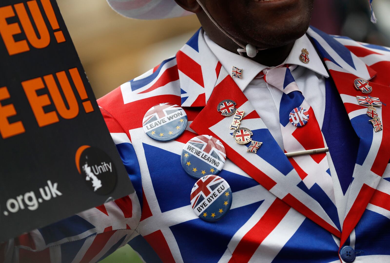 FILE - A Brexit supporter demonstrates in Parliament Square in London, Friday, Jan. 31, 2020. (AP Photo/Alastair Grant, File)