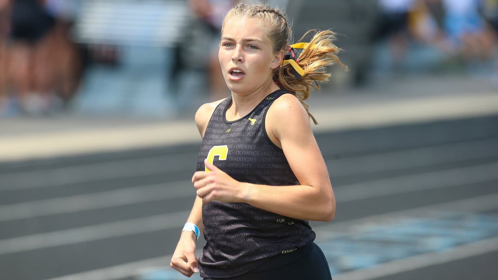 Centerville High School senior Emma Bucher sprints to the finish line at the Ohio High School Athletic Association Division I state track and field championships on Saturday afternoon at Hilliard Darby High School. CONTRIBUTED PHOTO BY MICHAEL COOPER