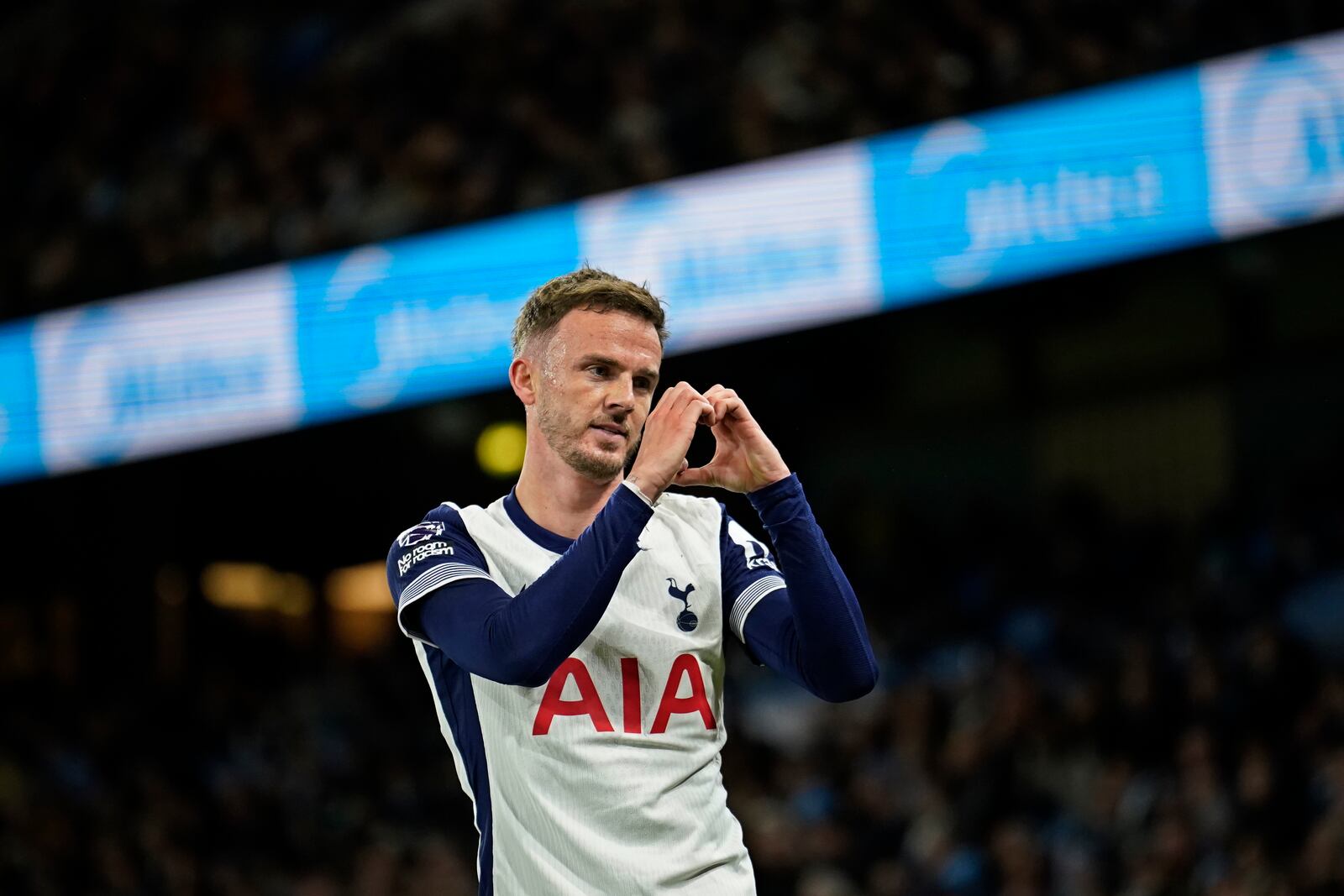 Tottenham's James Maddison celebrates after scoring his side's second goal during the English Premier League soccer match between Manchester City and Tottenham at the Etihad Stadium in Manchester, England, Sunday, Nov. 24, 2024. (AP Photo/Dave Thompson)