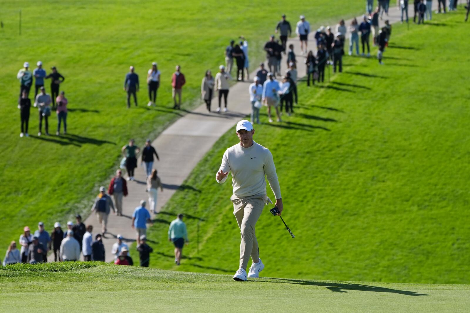 Rory McIlroy, of Northern Ireland, walks onto the 13th green of the South Course at Torrey Pines during the third round of the Genesis Invitational golf tournament Saturday, Feb. 15, 2025, in San Diego. (AP Photo/Gregory Bull)