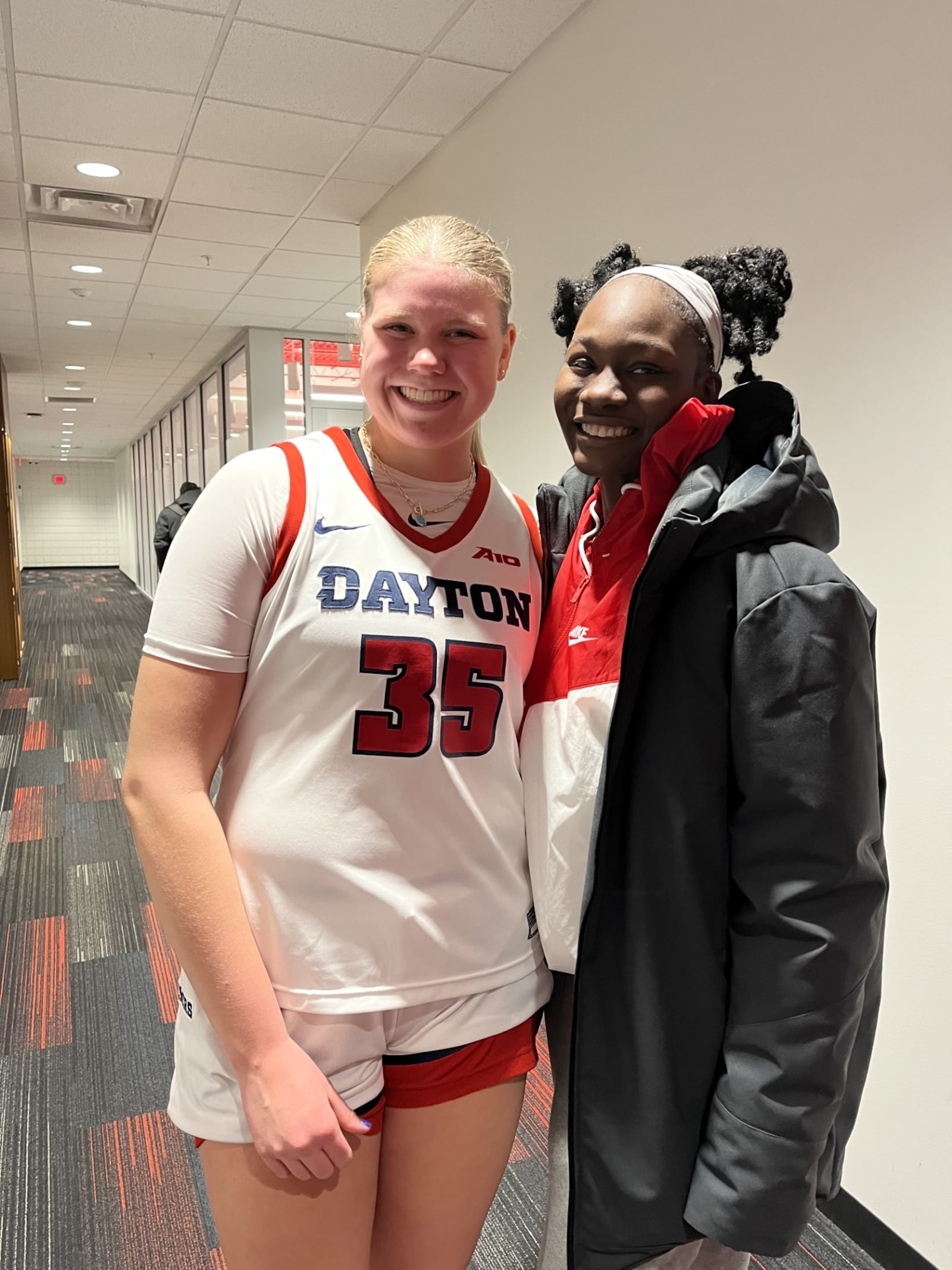 Dayton's Molly O'Riordan and Arianna Smith after Sunday's game vs. Richmond at UD Arena. UD Athletics photo