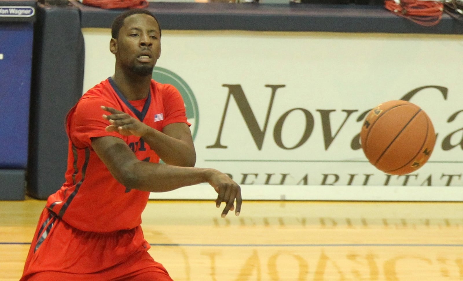 Dayton’s Scoochie Smith passes against La Salle on Saturday, Jan. 9, 2016, at Tom Gola Arena in Philadelphia. David Jablonski/Staff