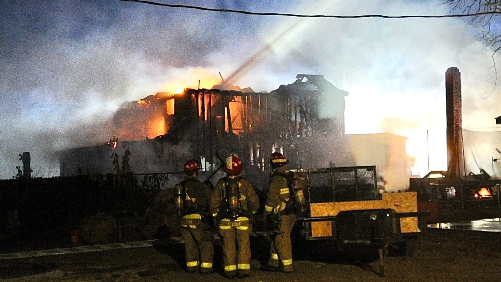 Fire destroyed a vacant house, the house next door and damaged a third house Monday evening, Nov. 7, 2022, in the 200 block of Alaska Street in Dayton. MARSHALL GORBY/STAFF