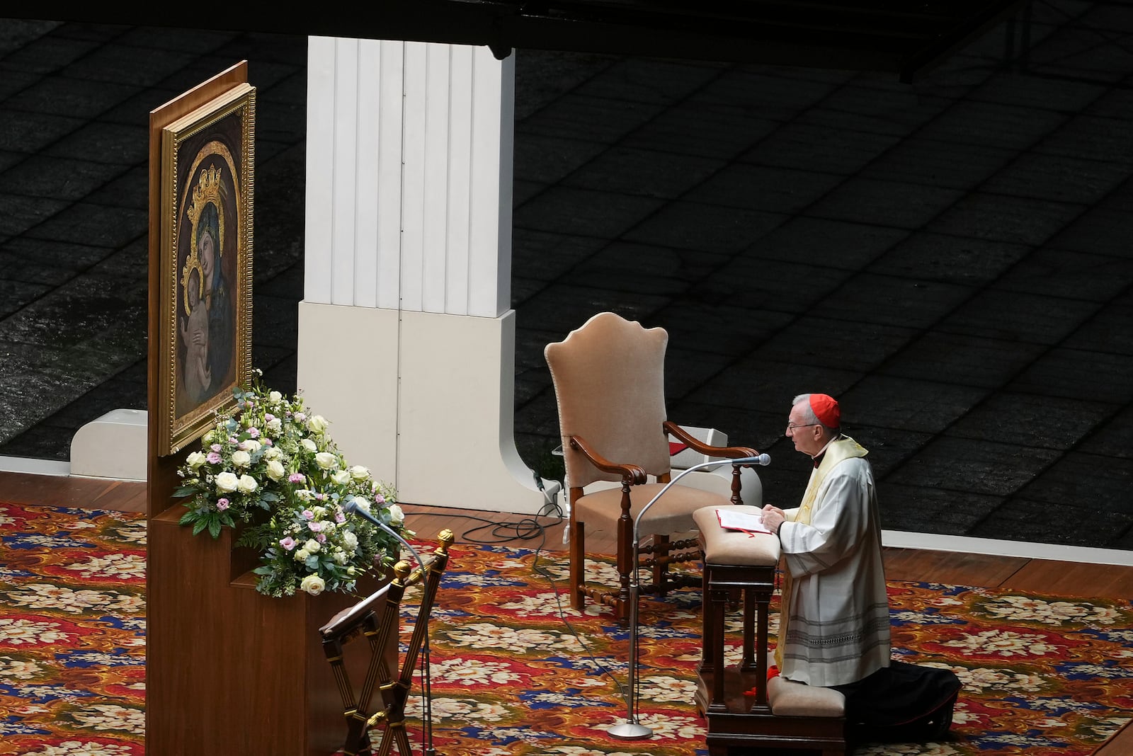 Cardinal Pietro Parolin, Vatican Secretary of State, kneels in front of a reproduction of the mosaic of the Madonna della Colonna (Madonna of the column) during a rosary vigil prayer held for the health of Pope Francis in St Peter's Square at The Vatican, Monday, Feb. 24, 2025. (AP Photo/Kirsty Wigglesworth)