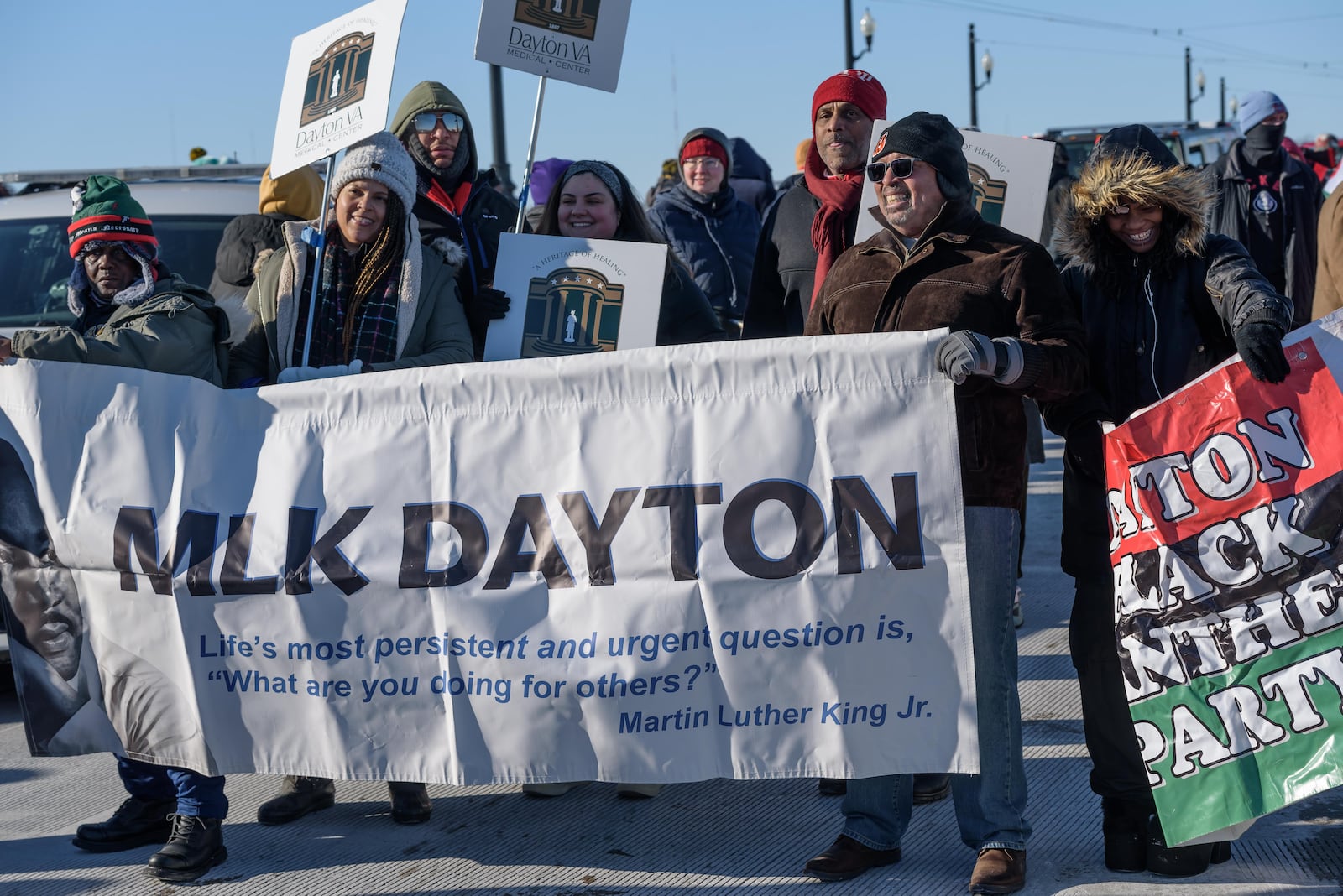 Daytonians gathered to honor Rev. Dr. Martin Luther King Jr. at the annual MLK Day Memorial March on Monday, Jan. 20, 2025, amid sub-zero wind chills. The march started at the Drew Health Center on W. Third St. through the Wright Dunbar Business District and concluded on the Dayton Peace Bridge. TOM GILLIAM / CONTRIBUTING PHOTOGRAPHER