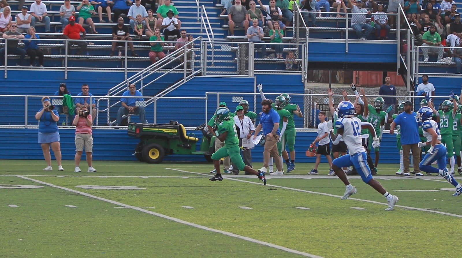 Aiden Lowery of Chaminade Julienne runs for a touchdown in the first quarter of CJ's win over Miamisburg on Aug. 23, 2024, in Dayton.