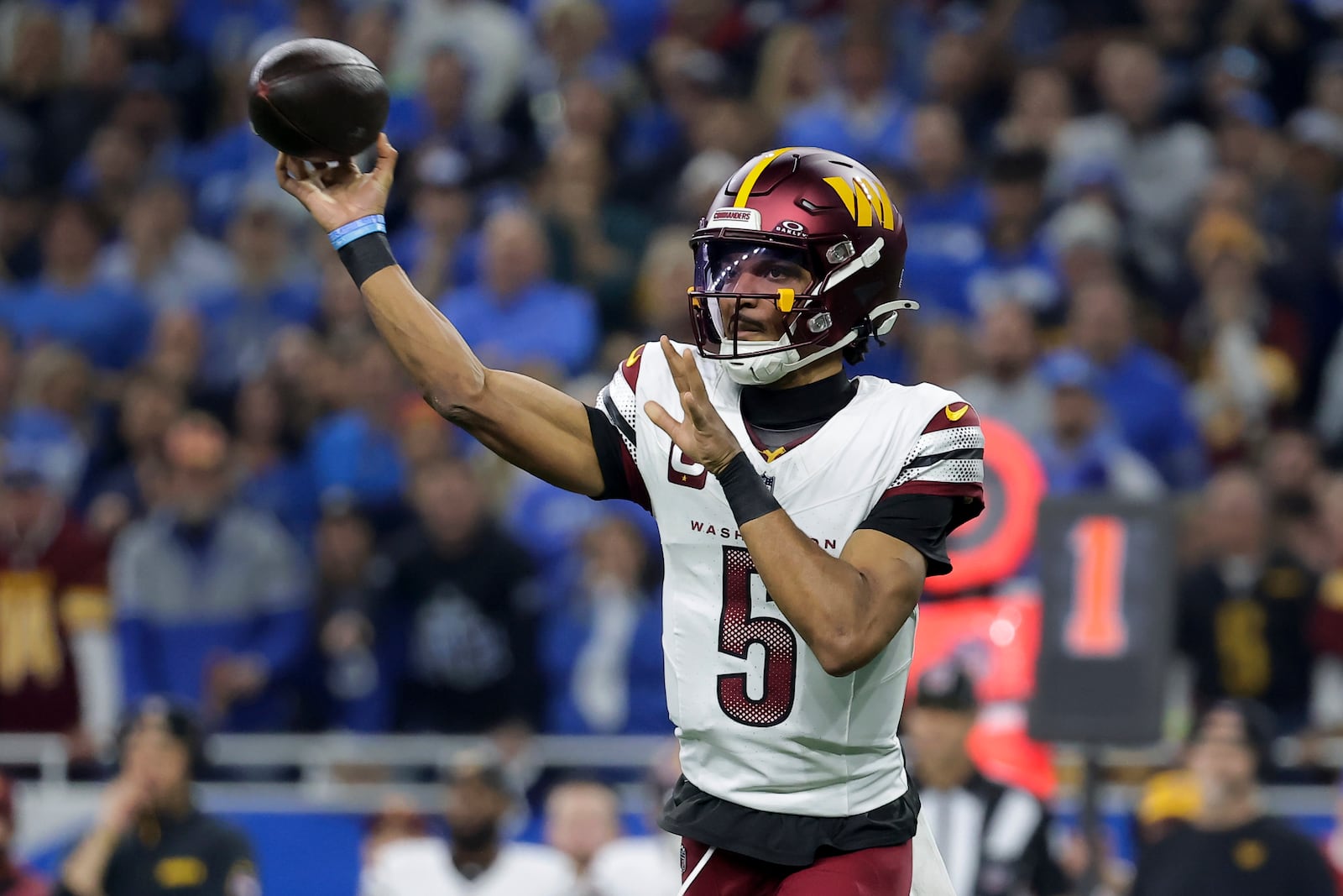 Washington Commanders quarterback Jayden Daniels (5) throws against the Detroit Lions during the first half of an NFL football divisional playoff game, Saturday, Jan. 18, 2025, in Detroit. (AP Photo/Rey Del Rio)