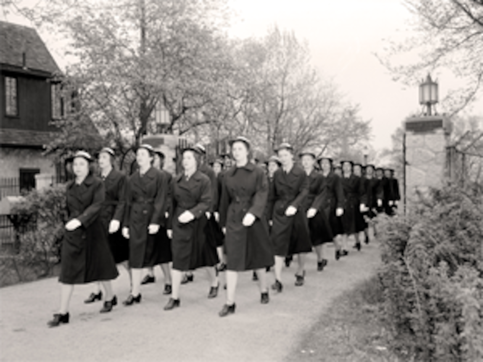 Members of the Women Accepted for Volunteer Emergency Service (WAVES) marching past the NCR Sugar Camp gate house during the Second World War. Contributed