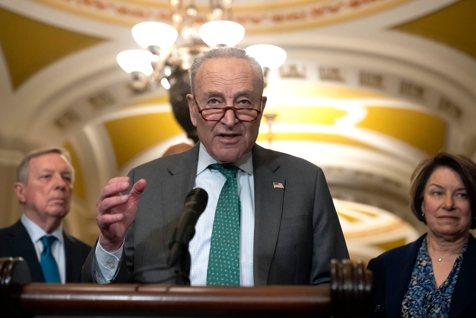 Sen. Charles Schumer, D-N.Y., speaks to reporters after a Senate policy luncheon on Capitol Hill, Tuesday, March 11, 2025, in Washington. (AP Photo/Mark Schiefelbein)